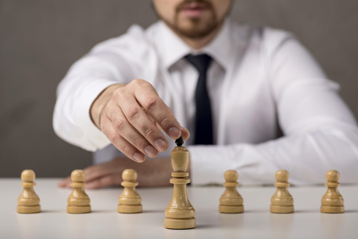 front-view-businessman-holding-king front-view-businessman-holding-king