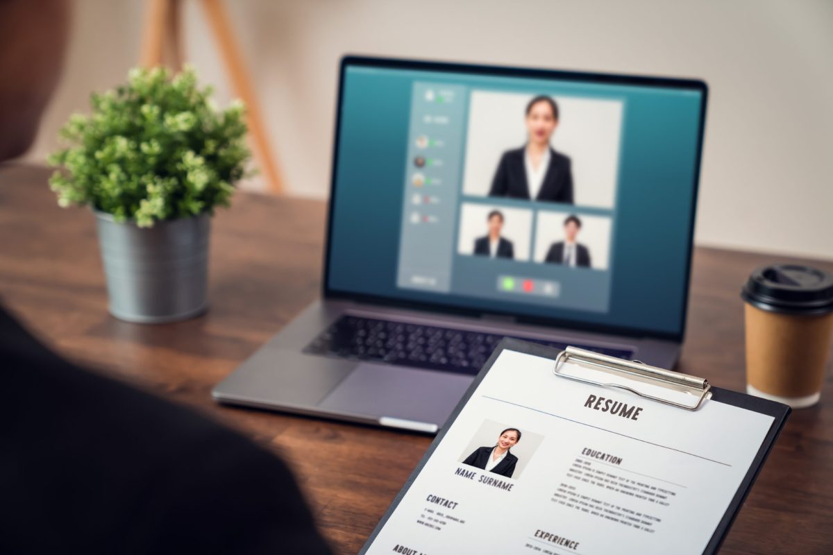Company HR is holding a resume application in hand. Video calling, chatting and interviewing online jobs via digital laptop, Technology network saves time and is easy to coordinate. Company HR is holding a resume application in hand. Video calling, chatting and interviewing online jobs via digital laptop, Technology network saves time and is easy to coordinate.