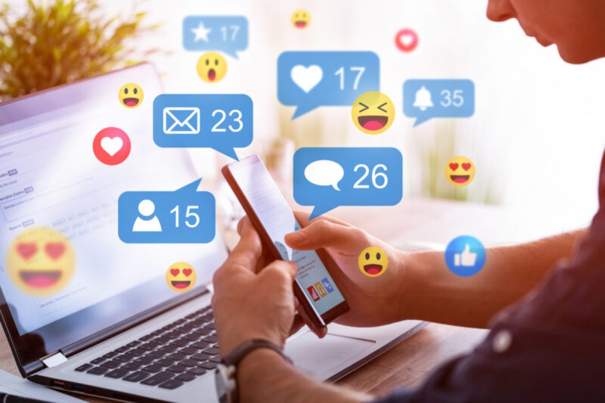 Social media concept. Like and share social media. Hands holding smartphone with social media network icons. Marketing concept.