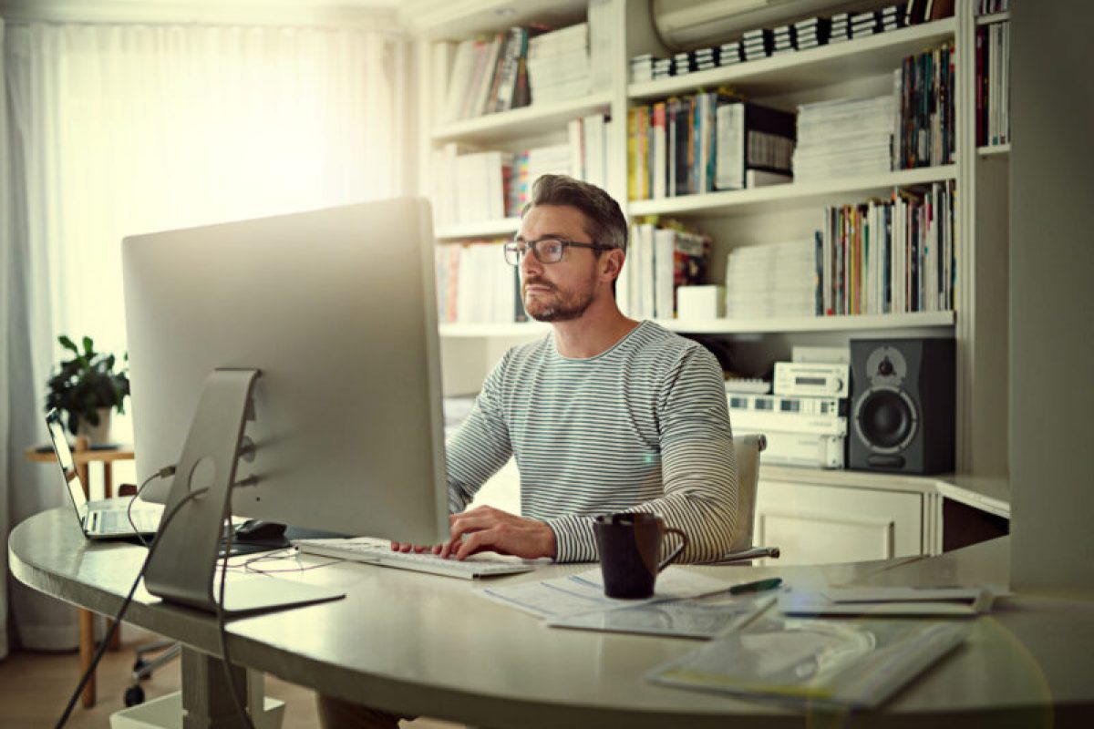 Persistence and determination are the true sources of success Cropped shot of a man sitting behind his computer in his home office